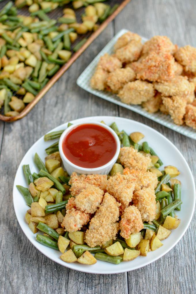 These Crispy Chicken Potato Bowls with Sweet Sweet and Spicy Ketchup are cooked on a sheet pan for an easy, healthy dinner recipe the whole family will love. 