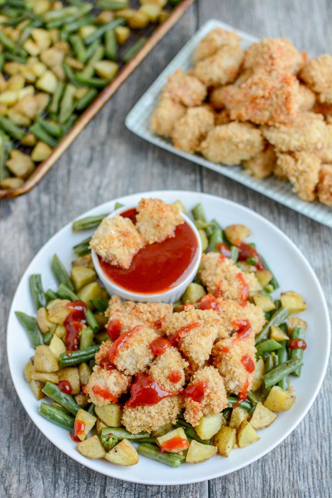 These Crispy Chicken Potato Bowls with Sweet Sweet and Spicy Ketchup are cooked on a sheet pan for an easy, healthy dinner recipe the whole family will love. 