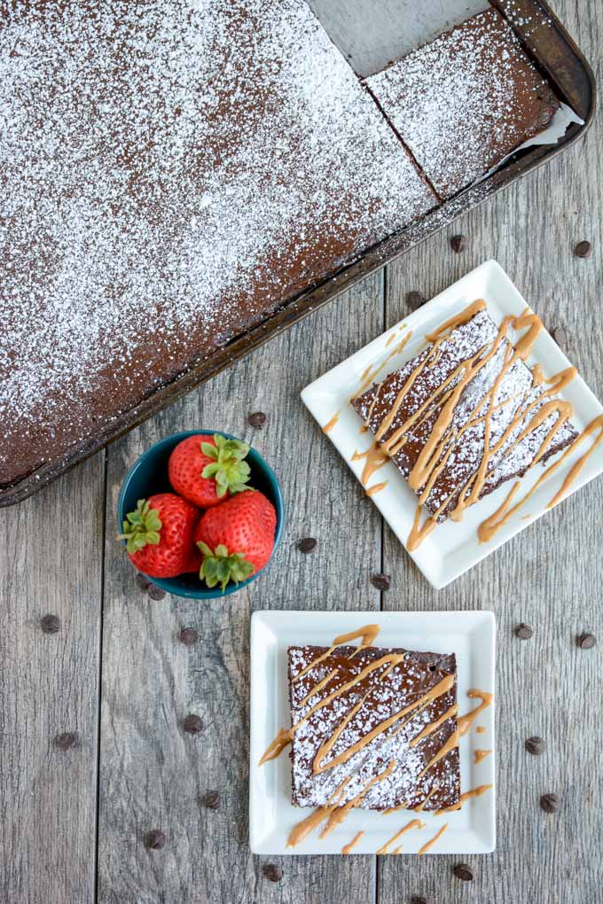 This Chocolate Sheet Cake is an easy dessert recipe and a fun change from a traditional round cake. Top with your favorite ice cream or a drizzle of peanut butter and some fresh strawberries. 