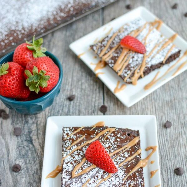This Chocolate Sheet Cake is an easy dessert recipe and a fun change from a traditional round cake. Top with your favorite ice cream or a drizzle of peanut butter and some fresh strawberries. 