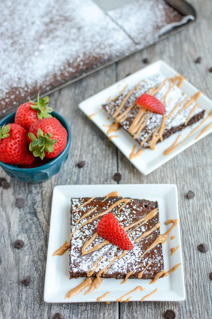 This Chocolate Sheet Cake is an easy dessert recipe and a fun change from a traditional round cake. Top with your favorite ice cream or a drizzle of peanut butter and some fresh strawberries. 
