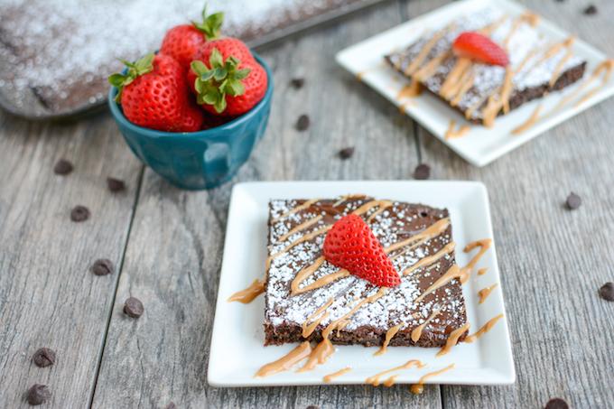 This Chocolate Sheet Cake is an easy dessert recipe and a fun change from a traditional round cake. Top with your favorite ice cream or a drizzle of peanut butter and some fresh strawberries. 