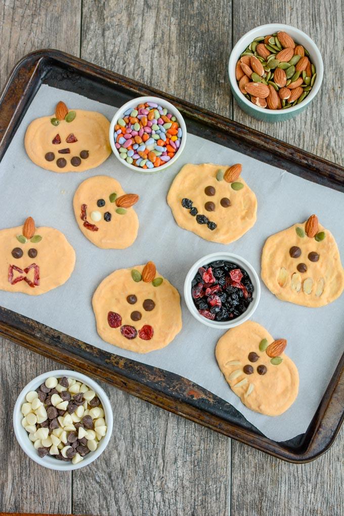 Pumpkin Yogurt decorated as jack-o-lanterns and frozen