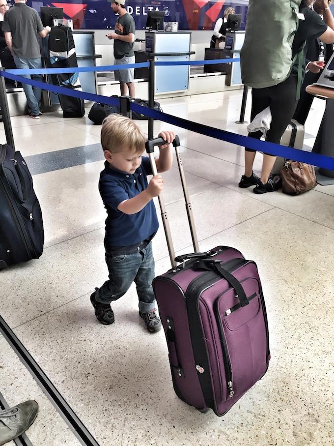 Toddler with suitcase