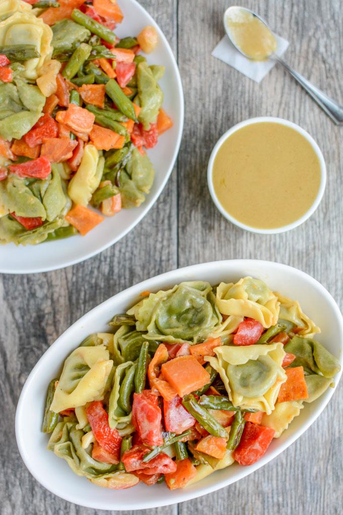 This Roasted Vegetable Pasta Salad with Maple Mustard Dressing is a simple, healthy vegetarian recipe. Serve it as an easy dinner side dish and pack the leftovers for lunch!