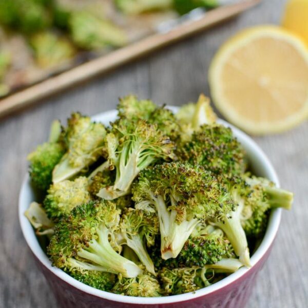 This Lemon Roasted Broccoli recipe is a simple, healthy dinner side dish. Ready in just 10 minutes and made with only 3 ingredients, this recipe is sure to be a hit!