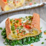 This Sausage and Egg Bread Boat is a perfect holiday breakfast or an easy brunch recipe! It can be prepped in just a few minutes and then you can just pop it in the oven and go spend time with your guests.