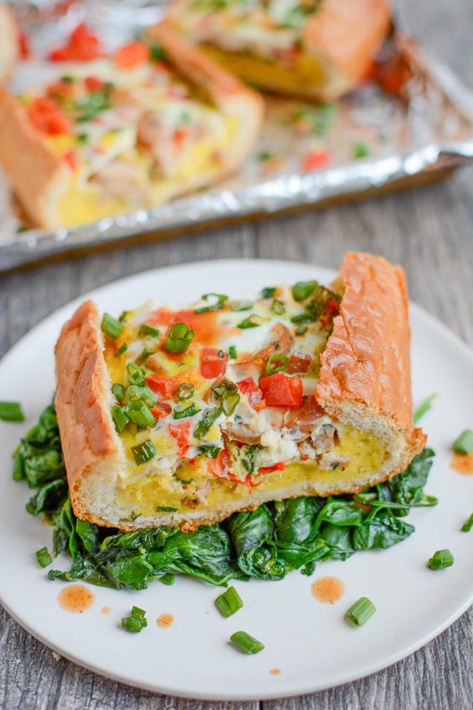 This Sausage and Egg Bread Boat is a perfect holiday breakfast or an easy brunch recipe! It can be prepped in just a few minutes and then you can just pop it in the oven and go spend time with your guests.