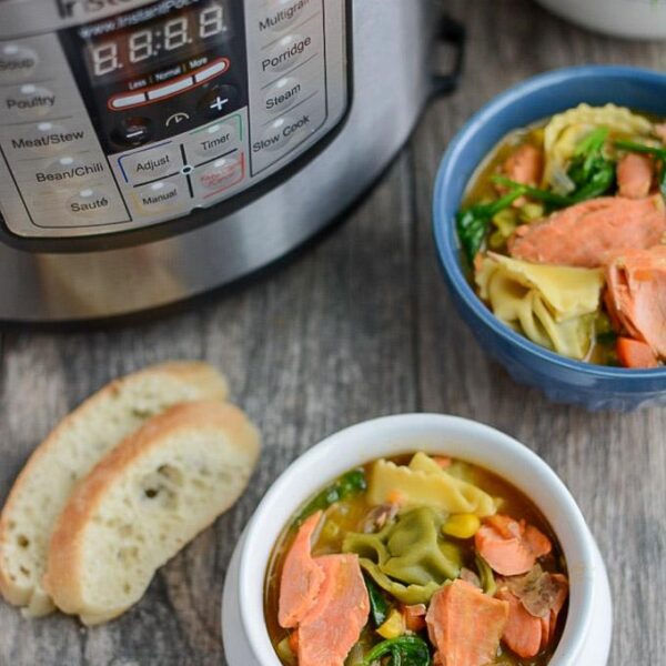 This Instant Pot Salmon Tortellini Soup recipe is simple, healthy and so easy to make for dinner. It uses ingredients from your freezer so its perfect for a night when you need a last minute meal. 