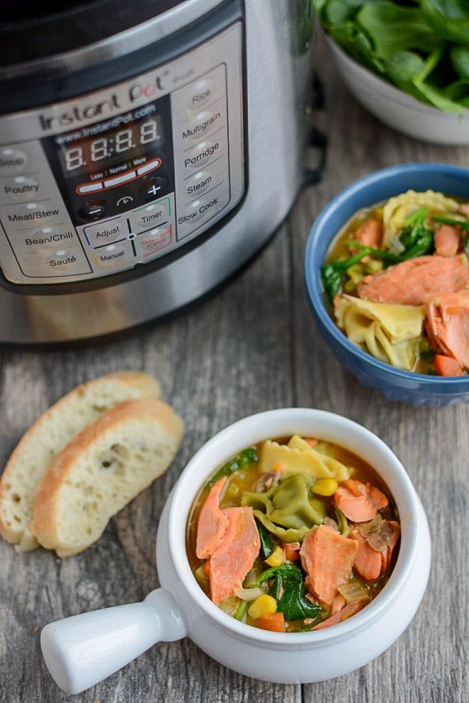 This Instant Pot Salmon Tortellini Soup recipe is simple, healthy and so easy to make for dinner. It uses ingredients from your freezer so its perfect for a night when you need a last minute meal. 