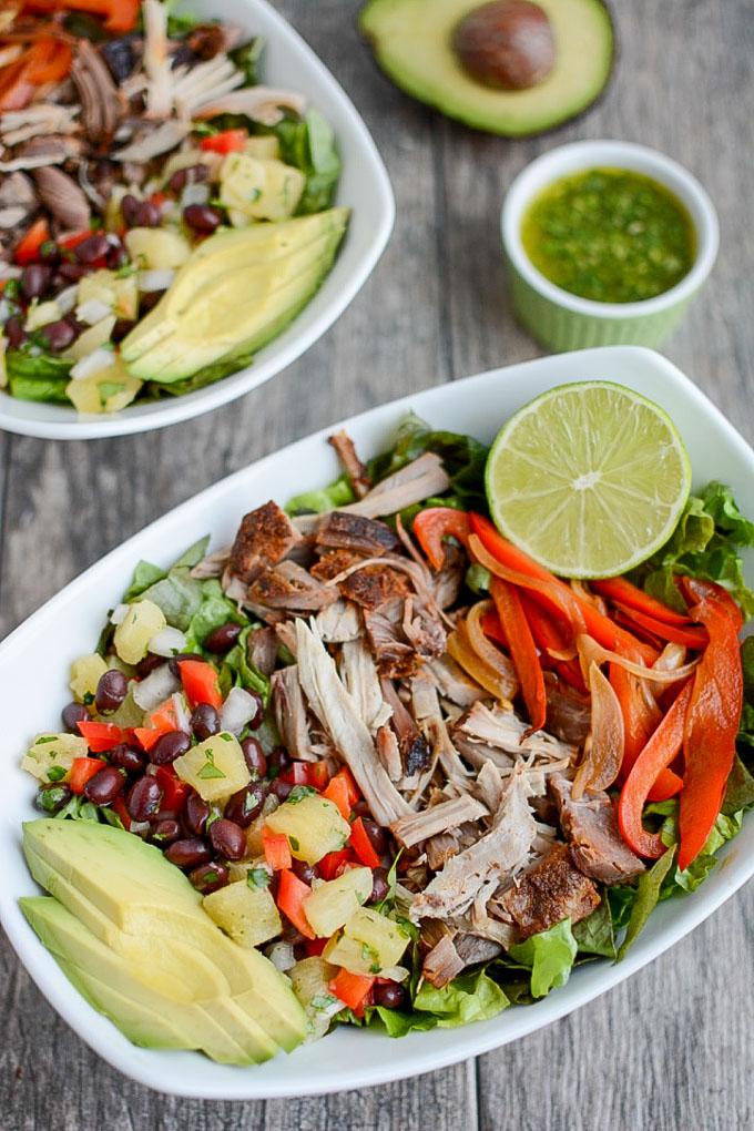 This Pulled Pork Fajita Salad is the perfect way to transform leftover pulled pork into a healthy new lunch or dinner. A pineapple black bean salsa and a light cilantro-lime dressing add extra flavor!