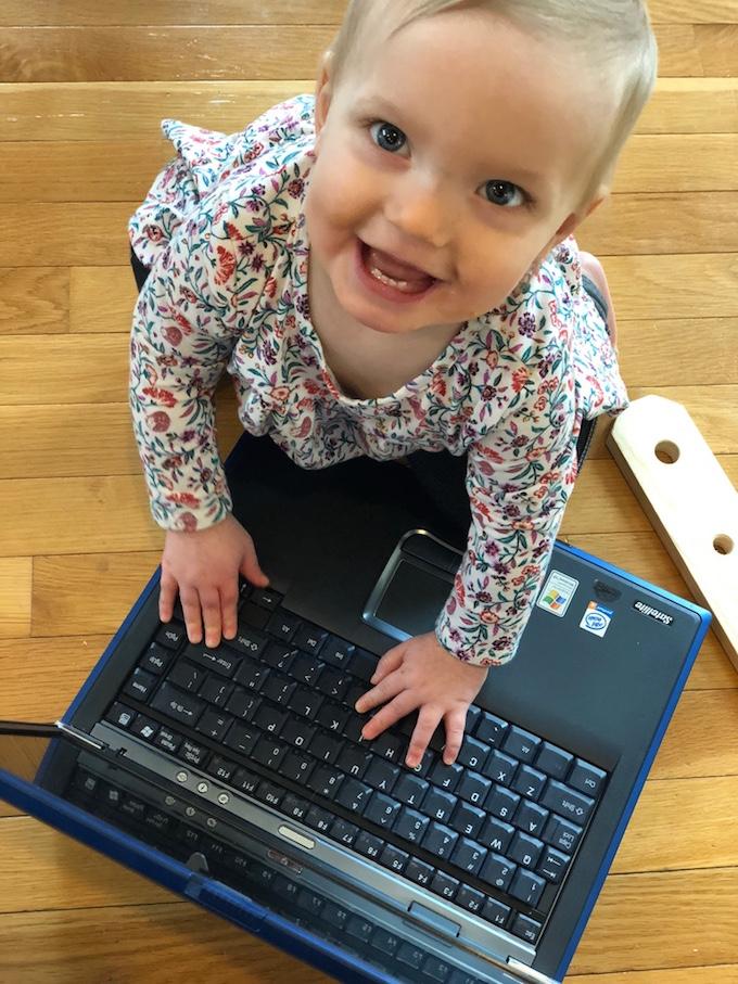 toddler with computer