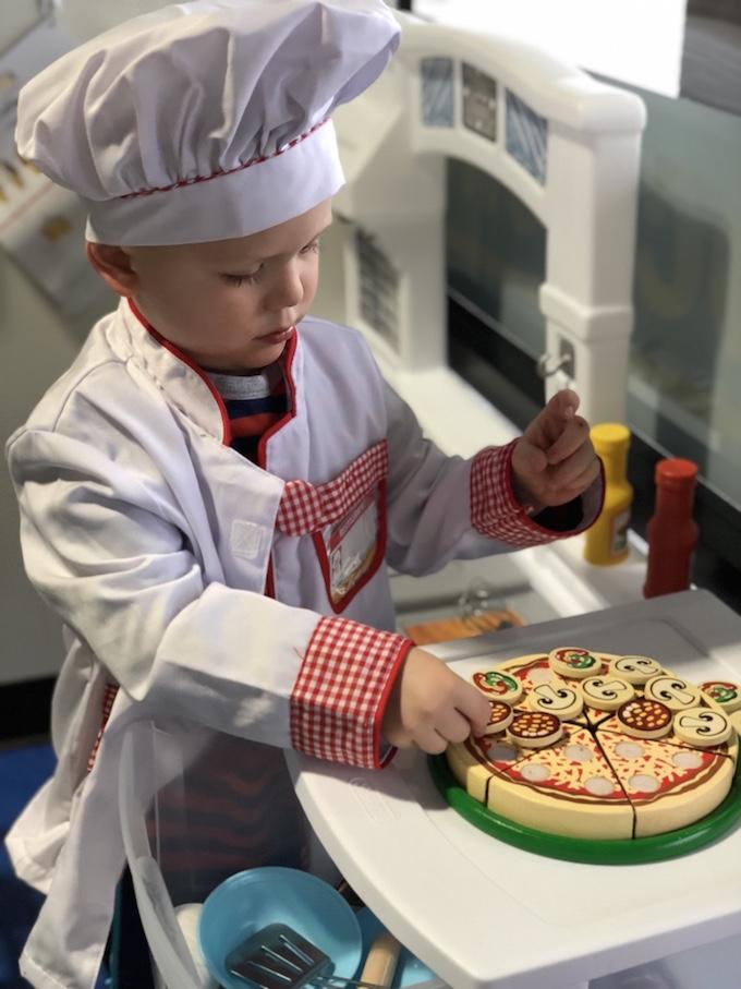 toddler in chef outfit