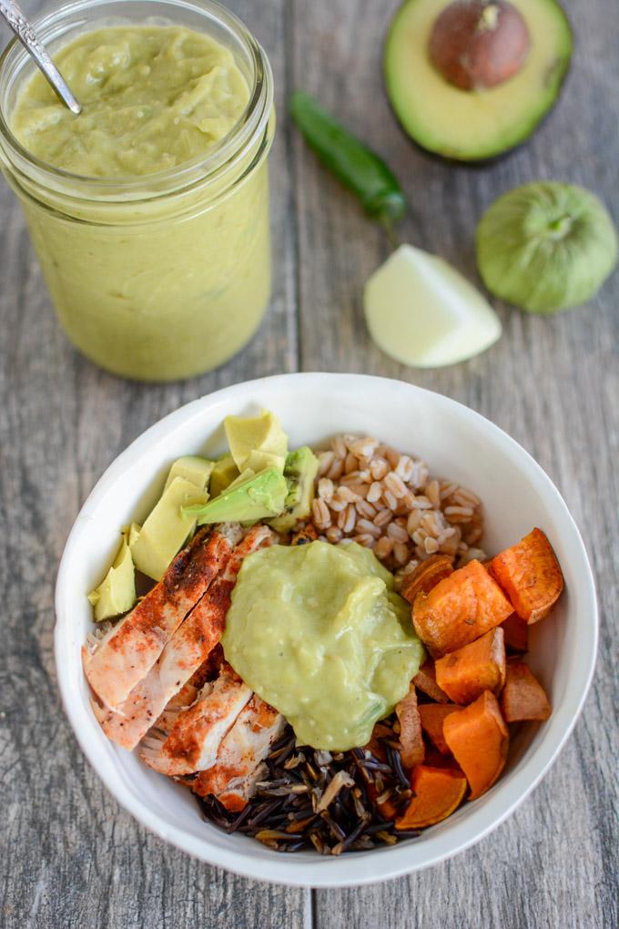 Spicy Green Sauce on a bowl of chicken, roasted vegetables, farro and wild rice.