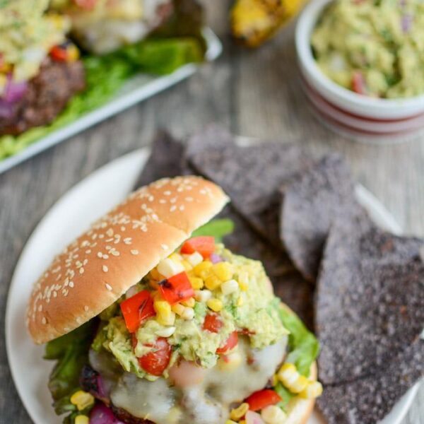 Mexican Burgers topped with grilled corn salsa, pepperjack cheese and guacamole