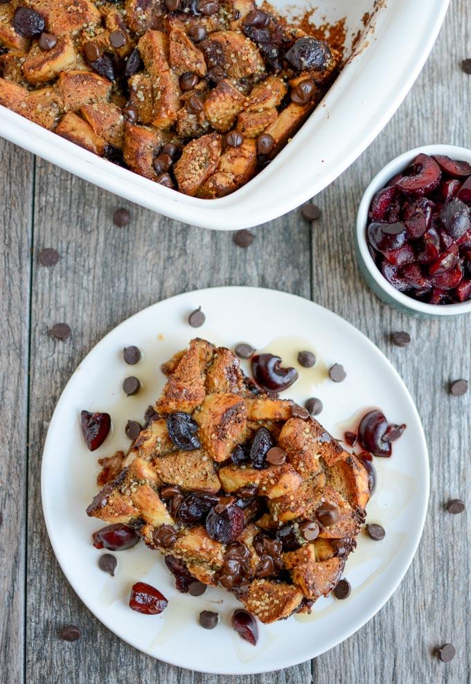 Sweet Cherry Gingerbread French Toast Bake topped with maple syrup and chocolate chips