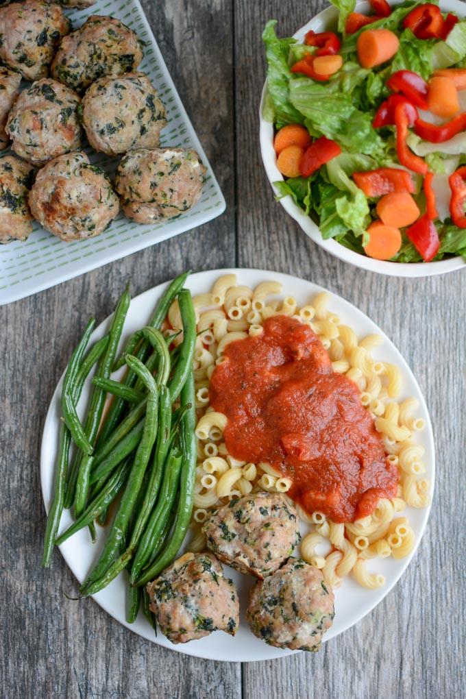 Spinach Feta Meatballs with pasta and salad