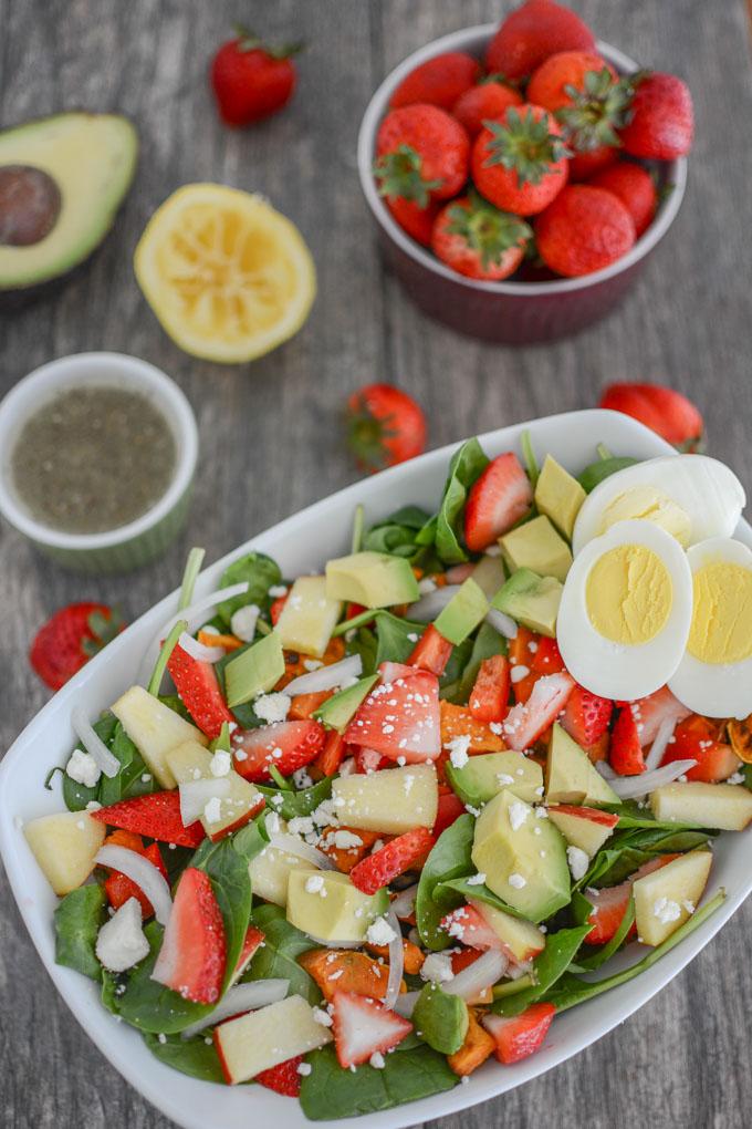 Loaded strawberry spinach salad with hard boiled eggs