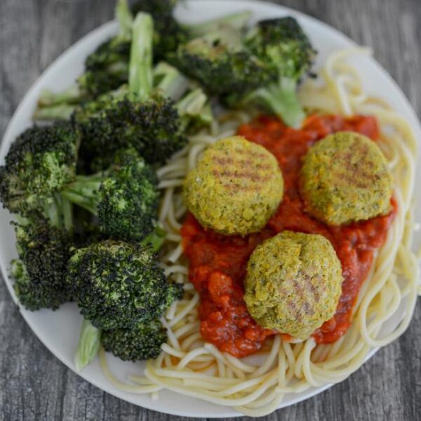 Pesto Lentil Balls over spaghetti with tomato sauce and roasted broccoli