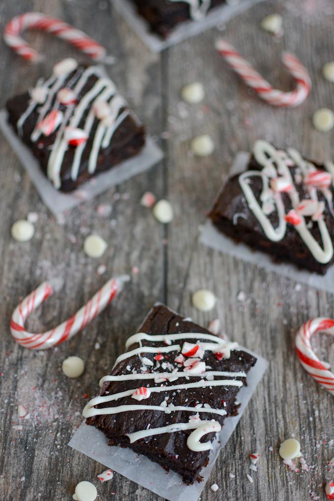 Peppermint Sweet Potato Brownies - topped with white chocolate drizzle and crushed candy canes