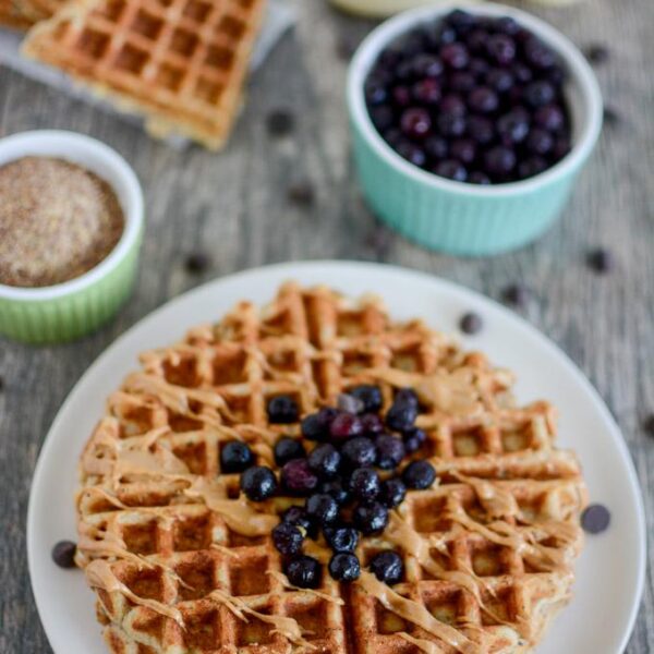 Banana Flax Waffles topped with blueberries and peanut butter