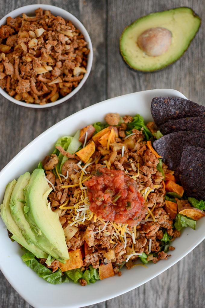 Turkey Walnut Taco Meat in a taco salad with roasted sweet potatoes and avocado