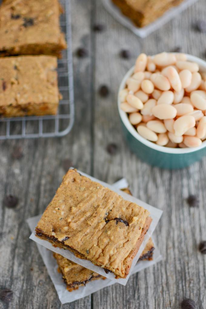 Sweet Potato White Bean Bars - stacked, on cooling rack and a bowl of beans