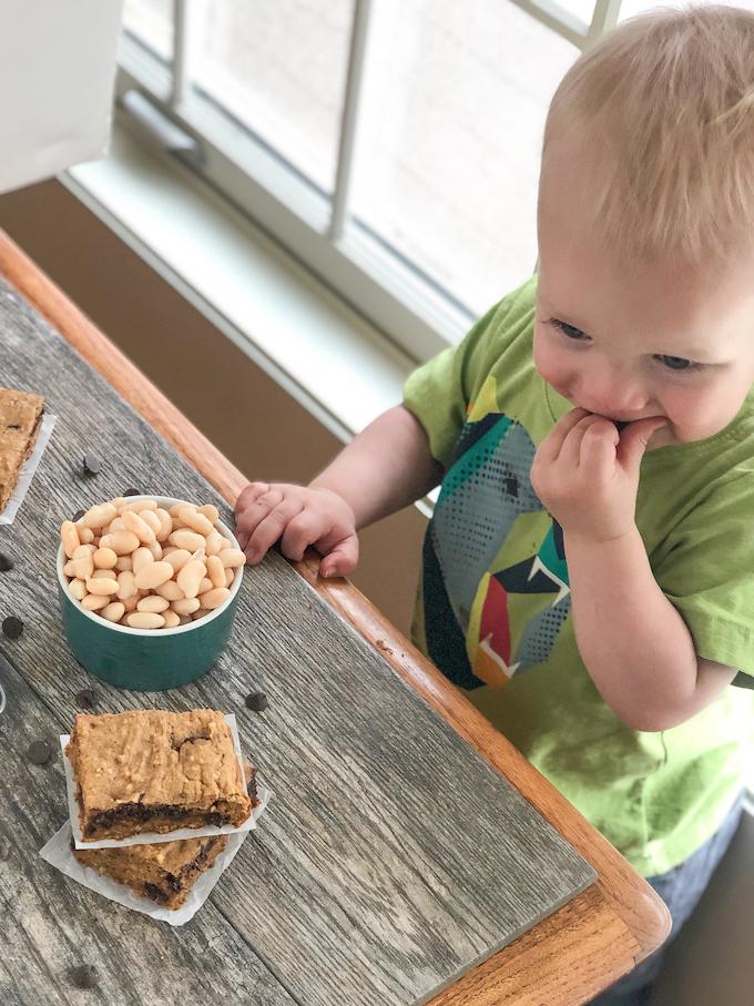 toddler eating sweet potato white bean bars
