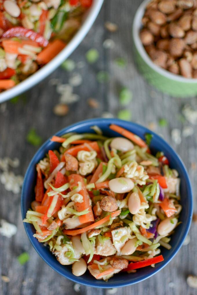 Broccoli slaw with ramen, topped with peanuts and green onions and and oil and vinegar dressing