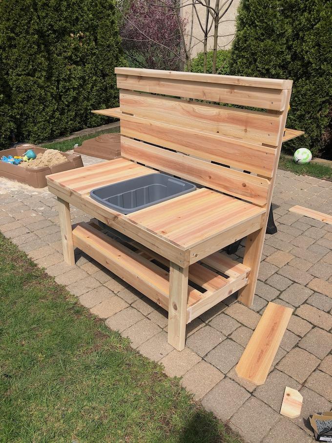 mud kitchen with cedar fence boards and 2x4s