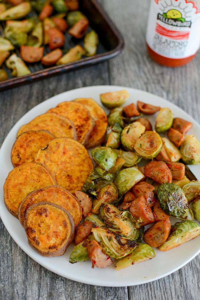 Oven Roasted Brussels Sprouts with chicken sausage and a side of roasted sweet potatoes