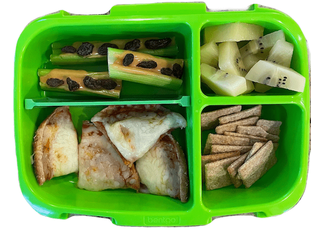 grade school lunch box with pizza, ants on a log, wheat thins and kiwi