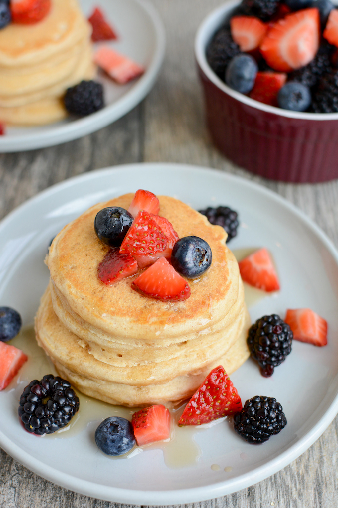 whole wheat pancakes with fresh fruit and syrup
