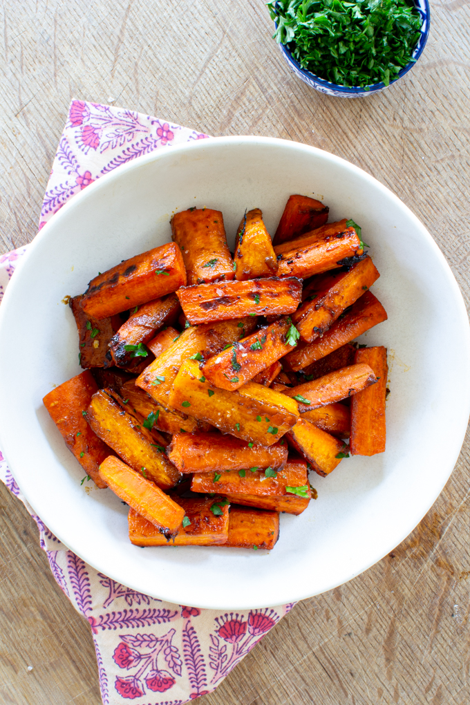 Maple Glazed Carrots 19 bowl of maple glazed carrots garnished with fresh herbs