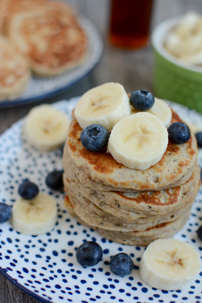 easy banana pancakes topped with bananas and blueberries